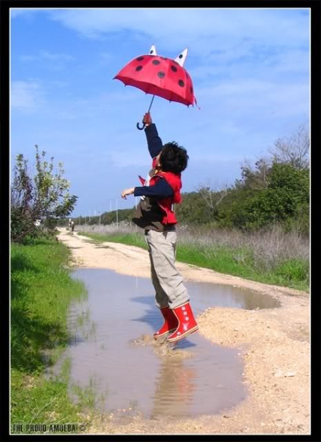 Umbrella_jump_by_Proud_amoeba.jpg rain image by Staernchen90